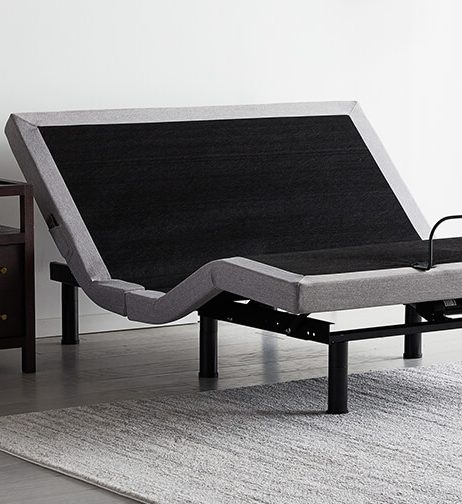 Adjustable bed base raised at the head and foot